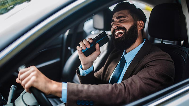 Man behind the wheel singing while driving